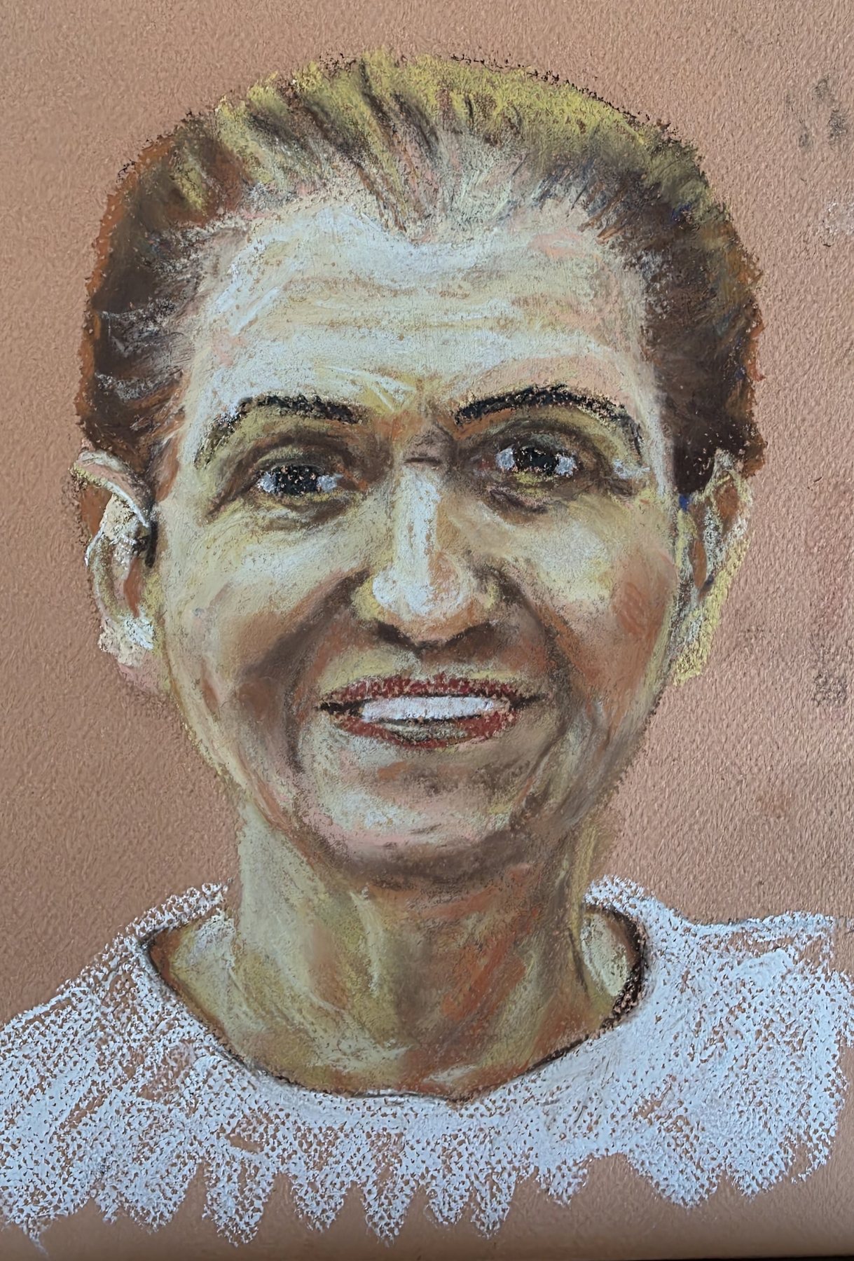 Soft pastel portrait of a smiling woman in a white lace top, on tan paper